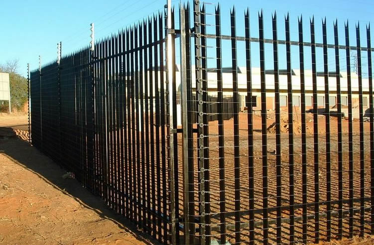 Industrial palisade fencing together with high tensile electric fencing for high security.