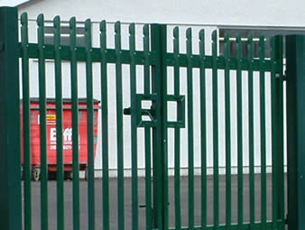 A factory with palisade fencing double gate - green powder coated