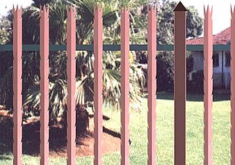 Red powder coated palisade fencing with 3-spiked top and razor spikes on each side of angle pale