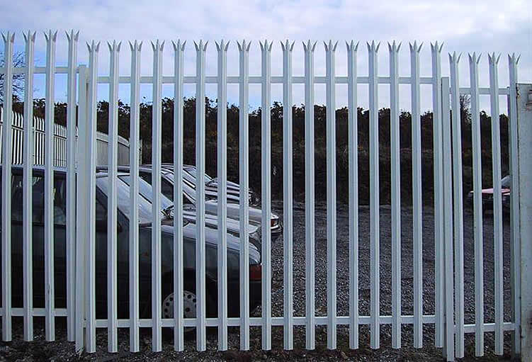White angle steel palisade fencing for a commercial place.
