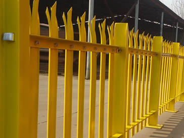 Yellow powder coated palisade fencing in our factory.