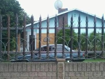 Angle steel palisade fencing with razor wire resist any intruders & threats for the family.